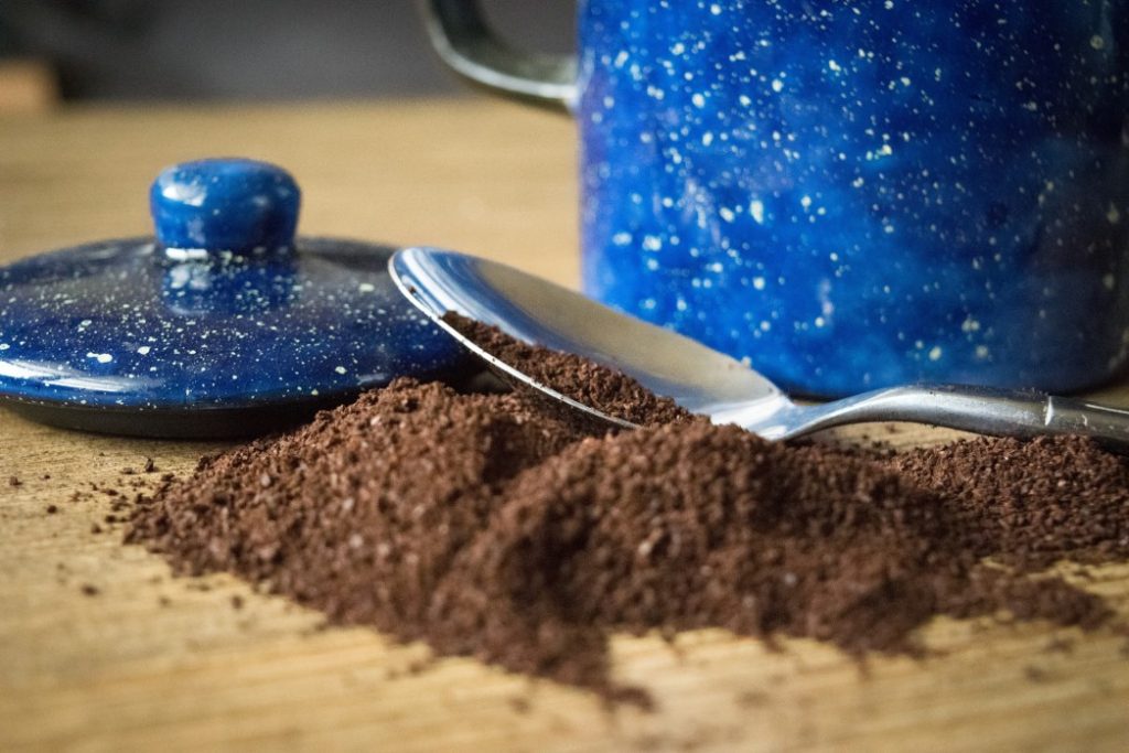 Coffee grounds being stored in a container